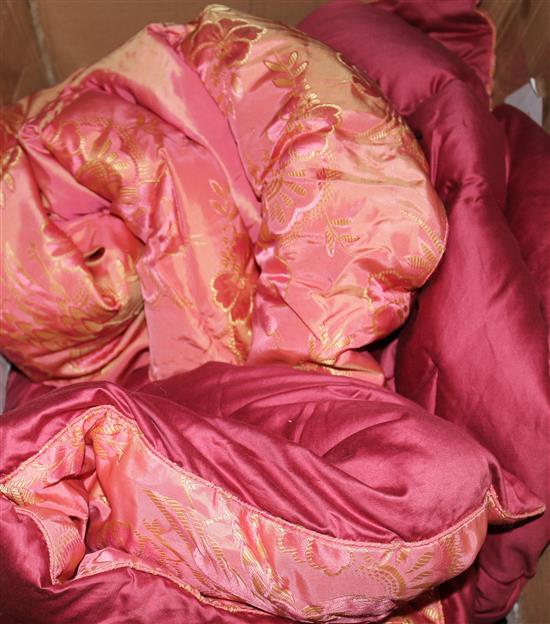 A pink with gilt birds and flowers pattern quilt